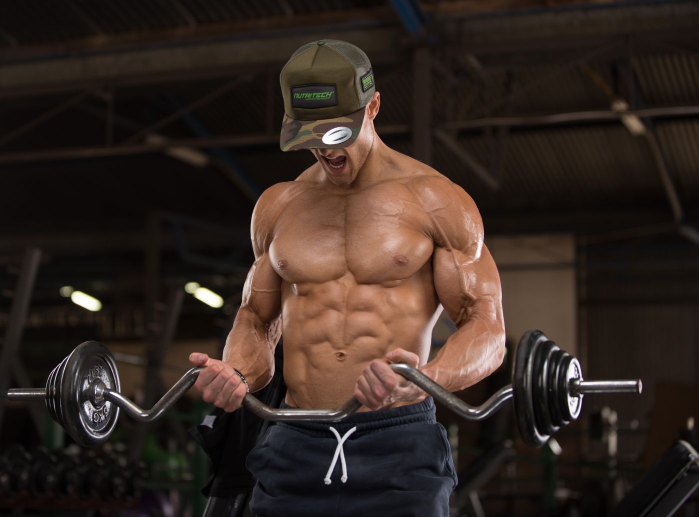 Dylan bicep curling with lean physique